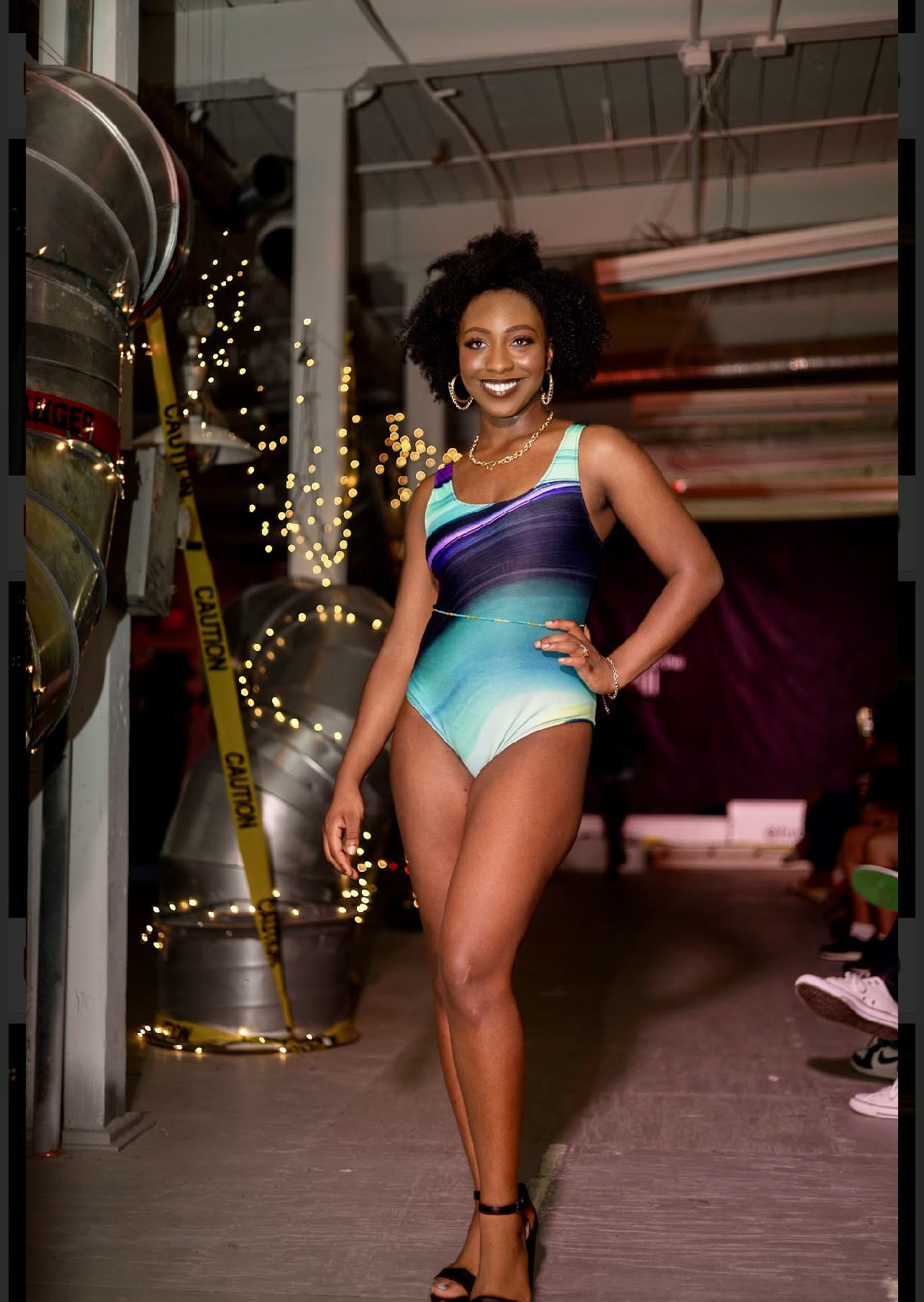 A woman in a bathing suit posing for the camera.