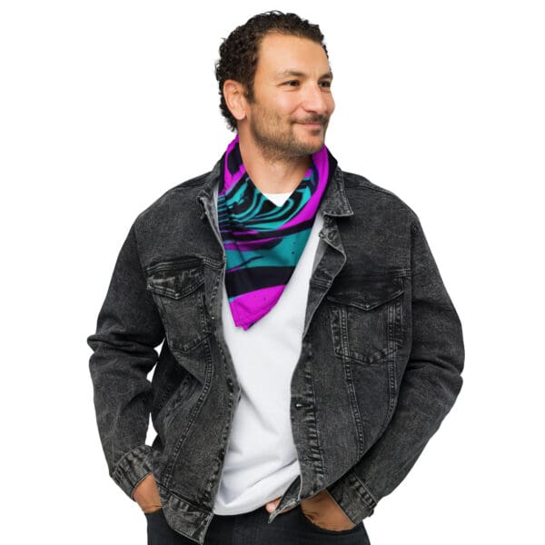 A man wearing a black jacket and purple scarf.