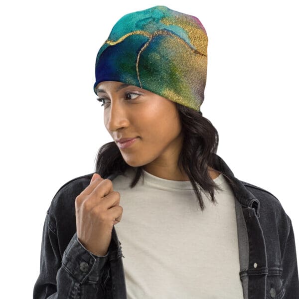 A woman wearing a hat with a colorful design.