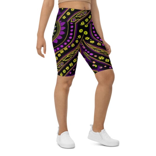 A man wearing purple and yellow shorts with green dots.