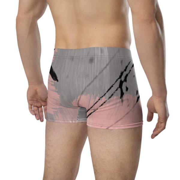 A man wearing pink and gray underwear with an abstract design.