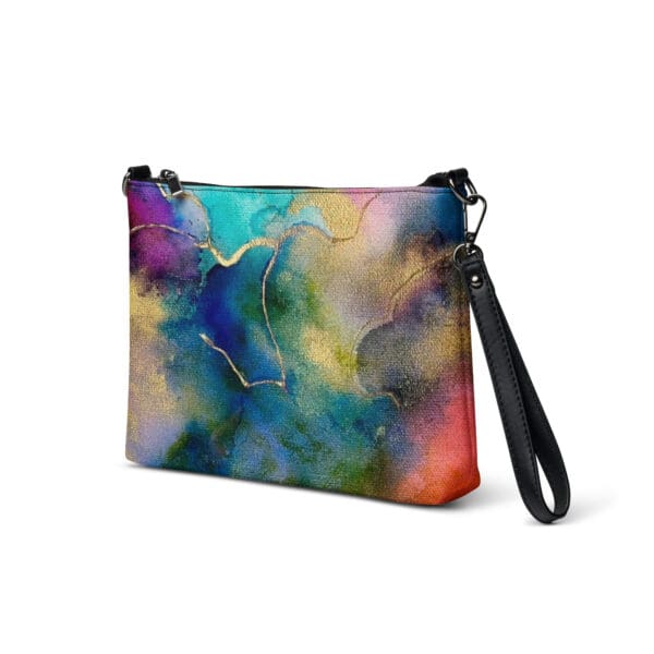 A colorful abstract painting with black handle