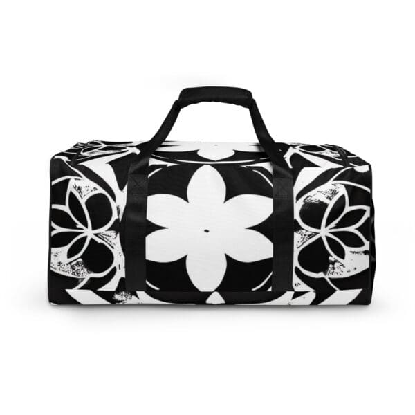 A black and white floral duffel bag with a handle.