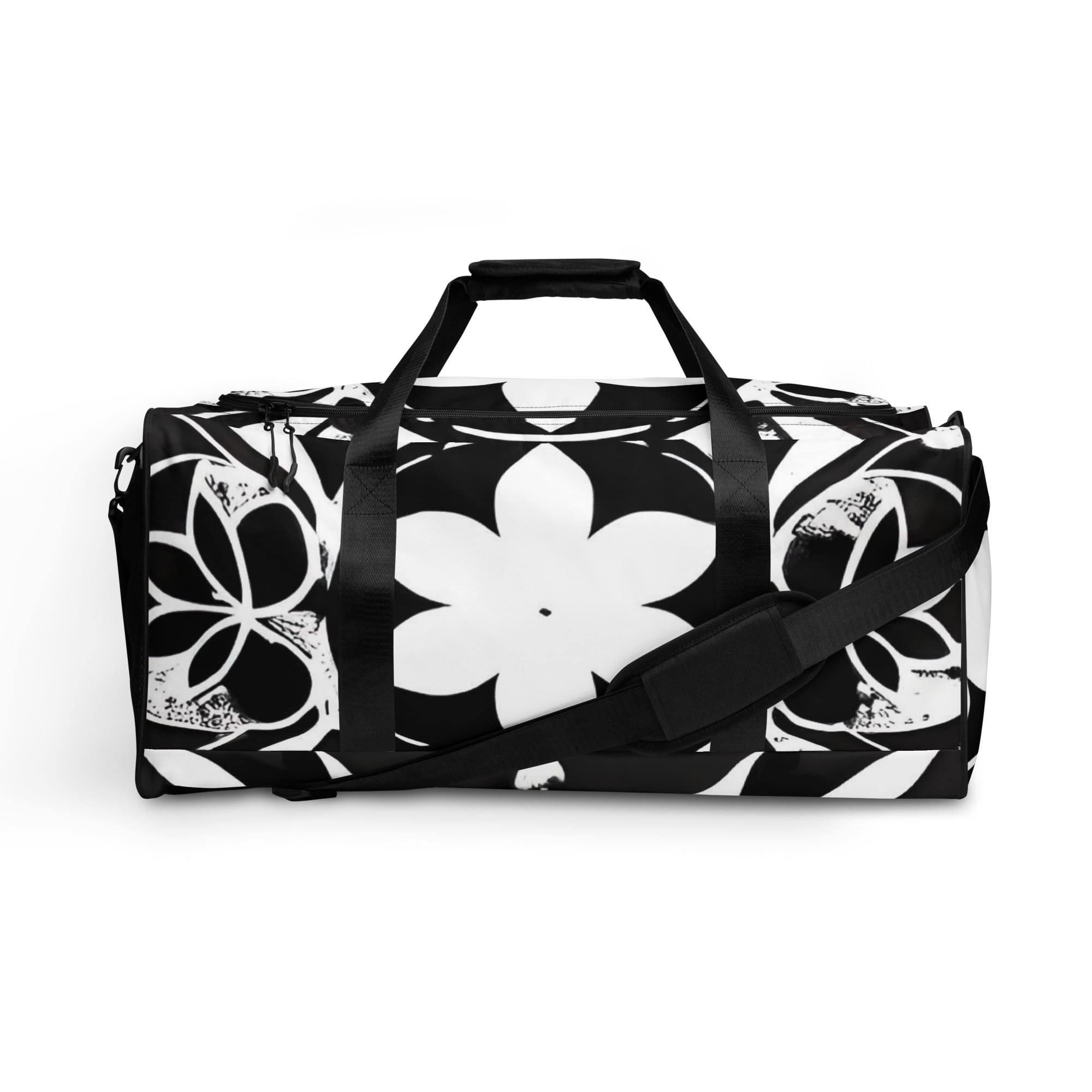 A duffel bag with black and white flowers on it.