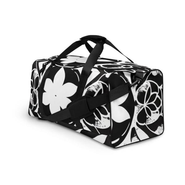 A black and white floral pattern duffel bag