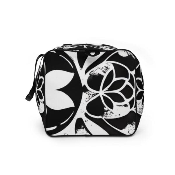 A black and white bag with a floral design.