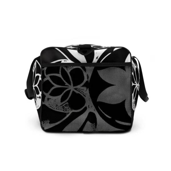 A black and white bag with flowers on it