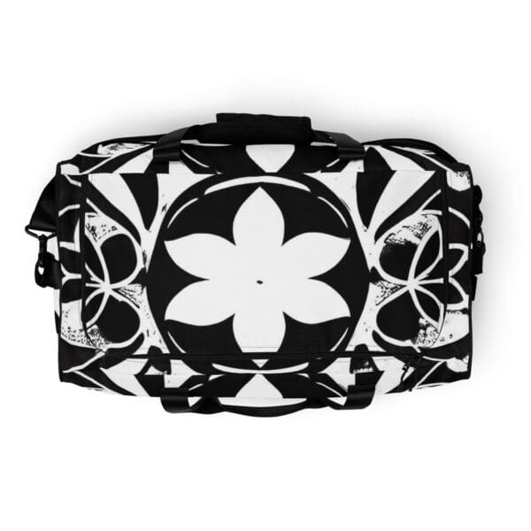 A black and white bag with flowers on it