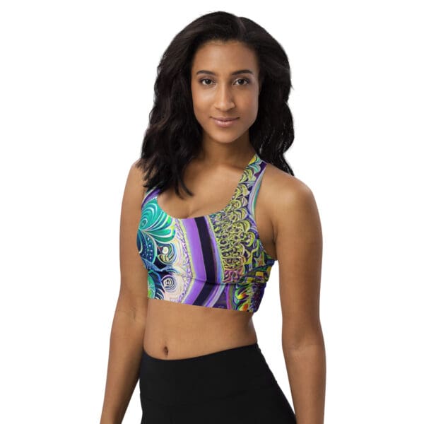 A woman wearing a sports bra with colorful designs.