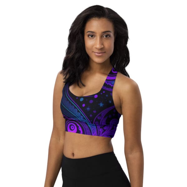 A woman wearing a purple and blue sports bra.