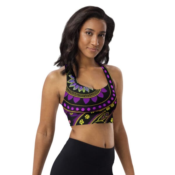 A woman wearing black and purple sports bra.