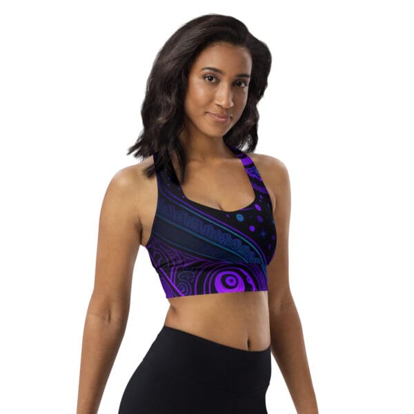 A woman in black and purple sports bra