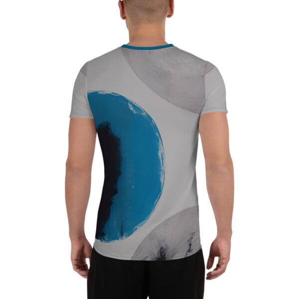 A man wearing a t-shirt with an abstract design.