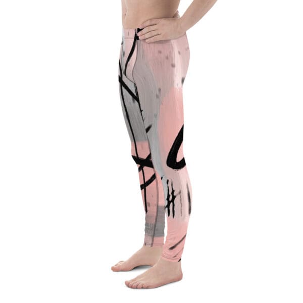 A man wearing pink and black pants with an abstract design.