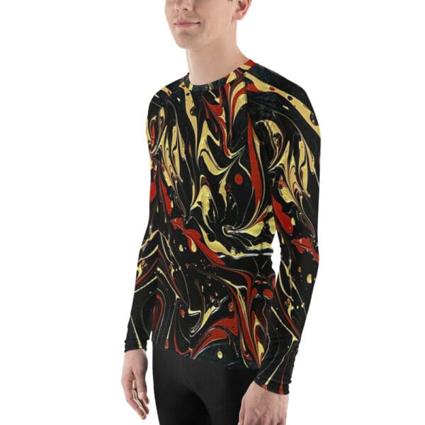 A man wearing a long sleeve shirt with abstract art.