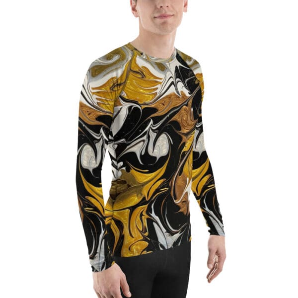 A man wearing a long sleeve shirt with abstract art.