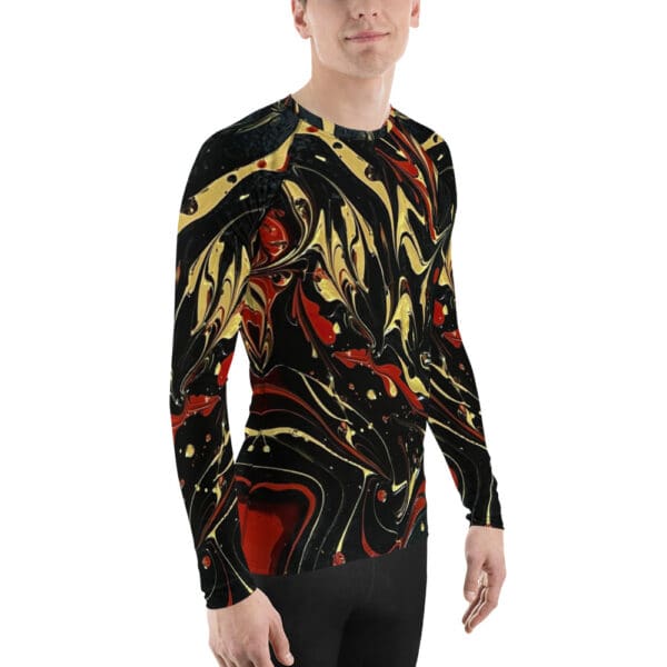 A man wearing a long sleeve shirt with an abstract design.