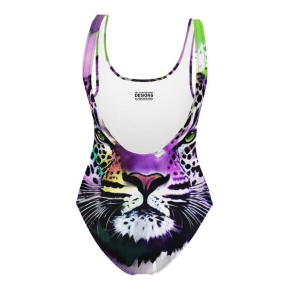 A purple and green swimsuit with a cat face on it.