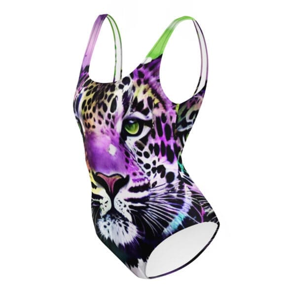 A purple and black swimsuit with a leopard face on it.