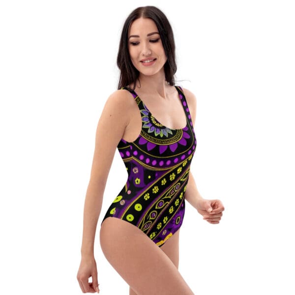 A woman in a purple and yellow bathing suit.