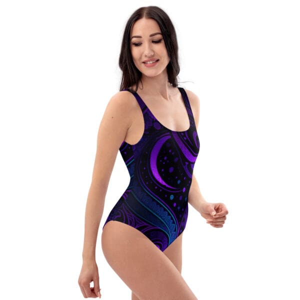 A woman in a purple and black swimsuit