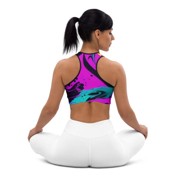 A woman sitting in the middle of her yoga pose.