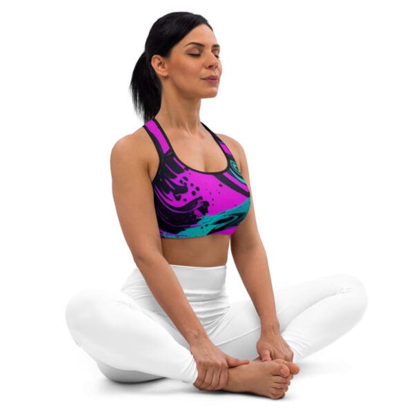 A woman sitting in the middle of her yoga pose.