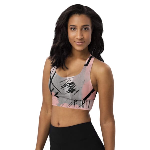 A woman wearing a sports bra with a picture of a skull on it.