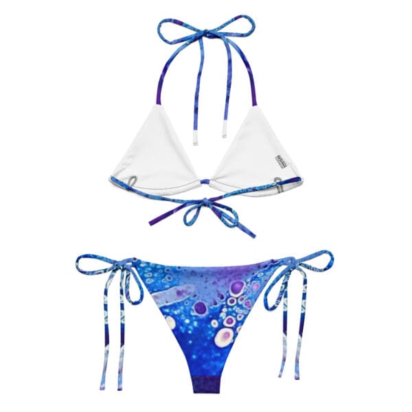 A bikini with two different colored ties on it