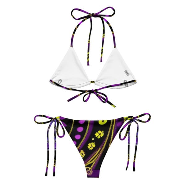 A purple and yellow bikini with flowers on it.