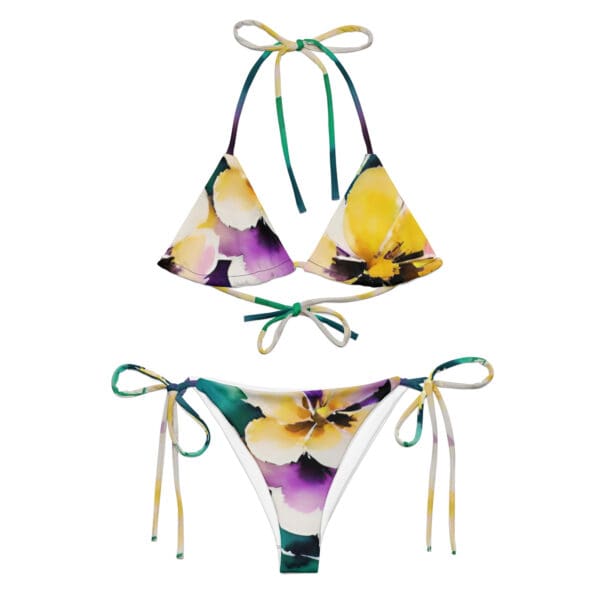 A bikini with flowers on it and a tie.