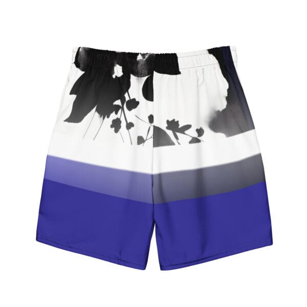 A pair of blue and white shorts with flowers on it.