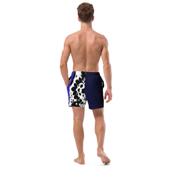 A man wearing blue and white swim trunks.