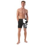 A man wearing black and white swim trunks.