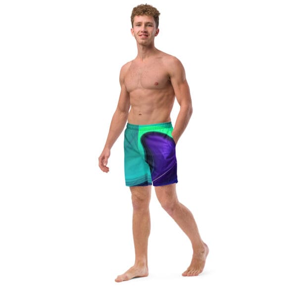 A man in blue and purple swim trunks.