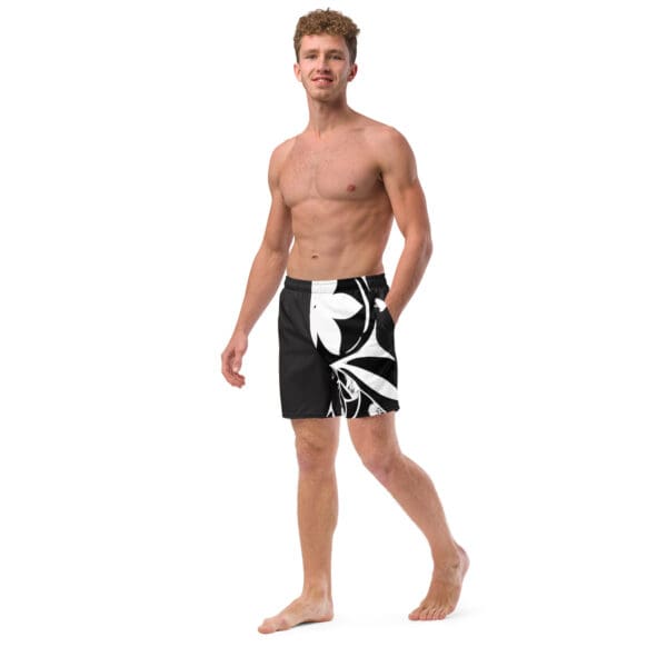 A man in black and white swim trunks.