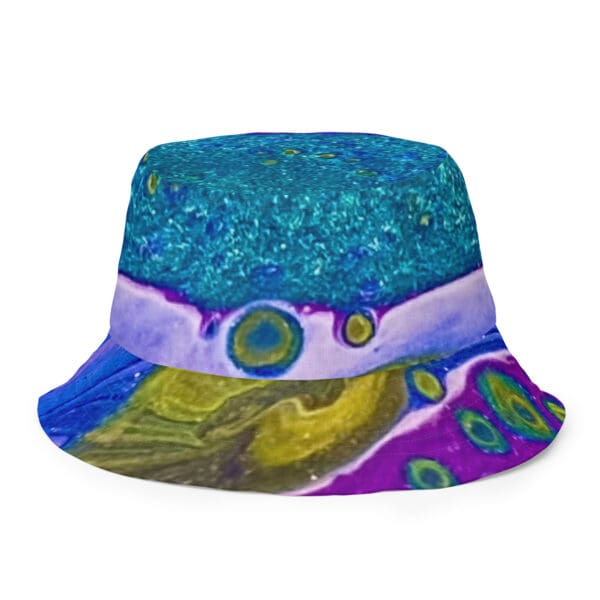 A blue and purple hat with a design on it