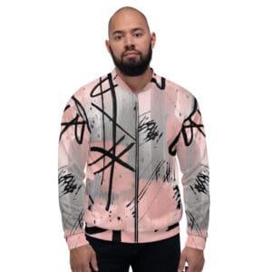 A man wearing a jacket with graffiti on it.