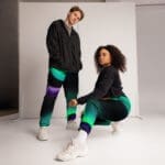Two models in colorful athletic wear.