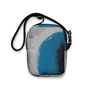 A blue and gray bag with a black strap.