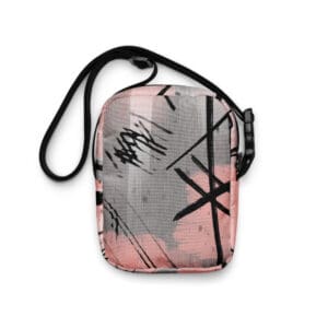 A pink and black bag with some writing on it