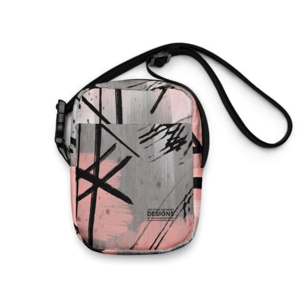 A pink and gray bag with black lines on it