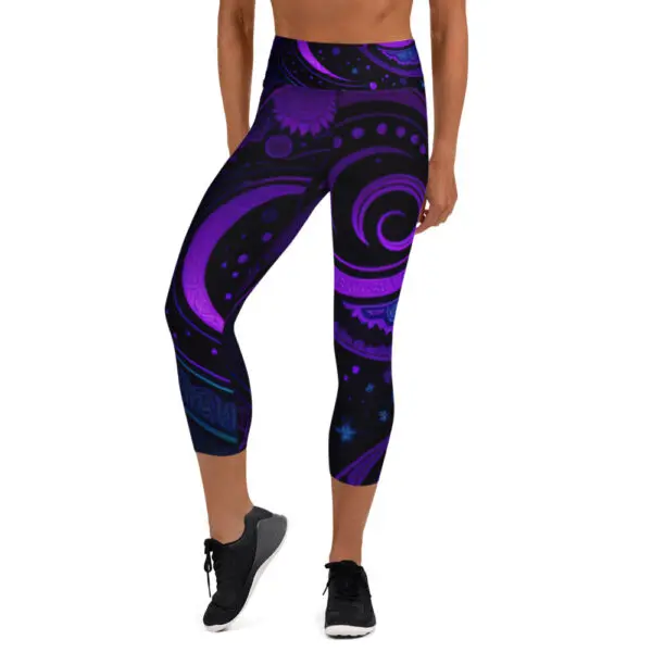 A woman wearing purple and black leggings with an abstract design.