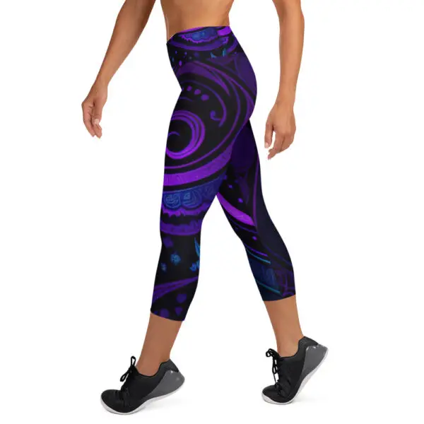 A woman is wearing purple and blue leggings