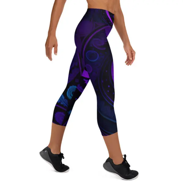 A woman is wearing purple and black leggings