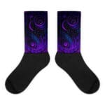 A pair of black socks with purple and blue designs