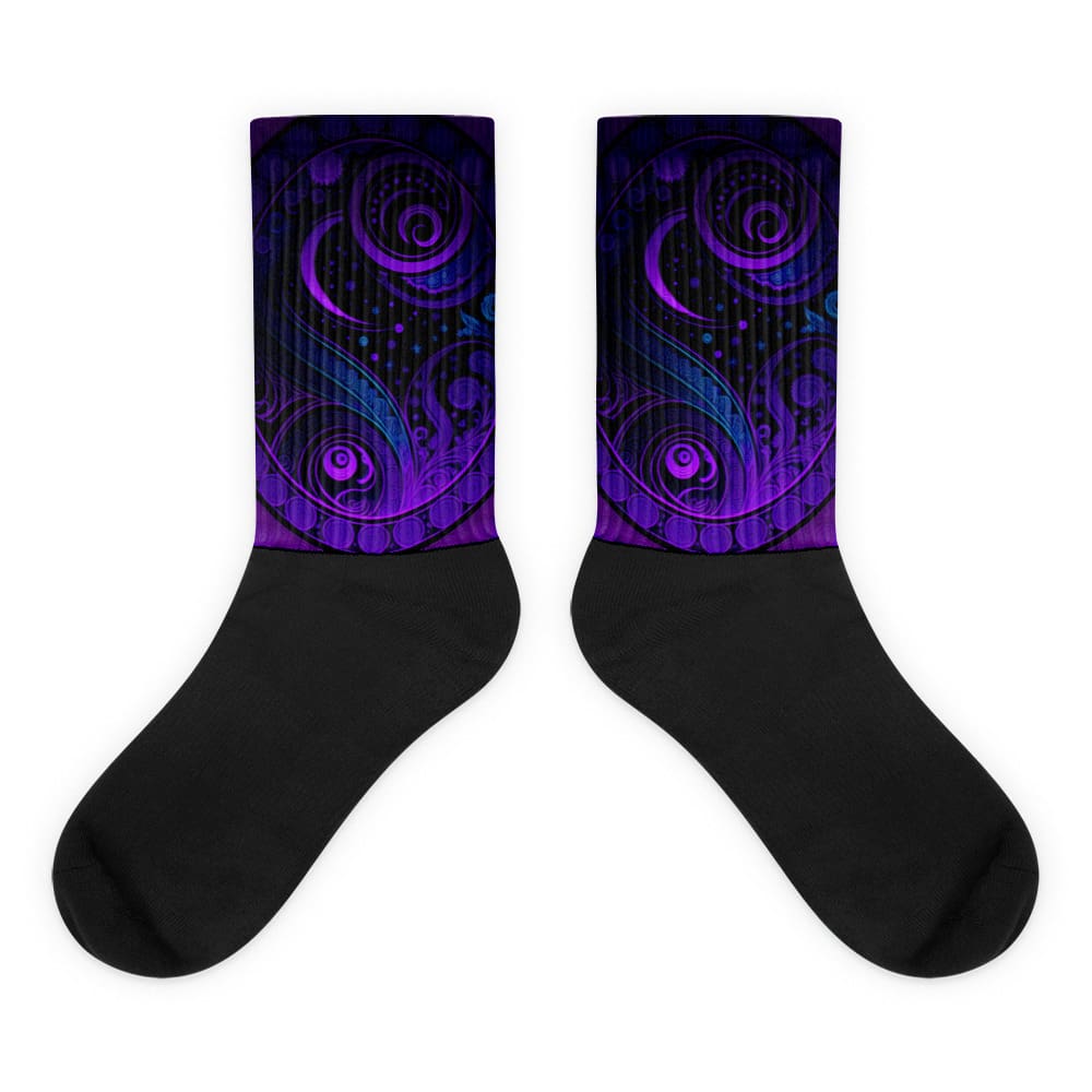 A pair of black socks with purple and blue designs