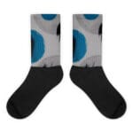 A pair of socks with blue and black polka dots.