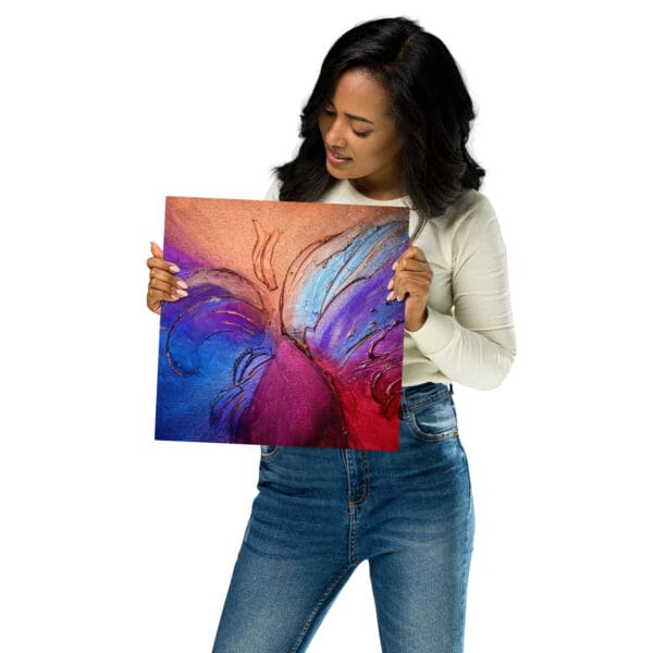 A woman holding up an image of a butterfly.