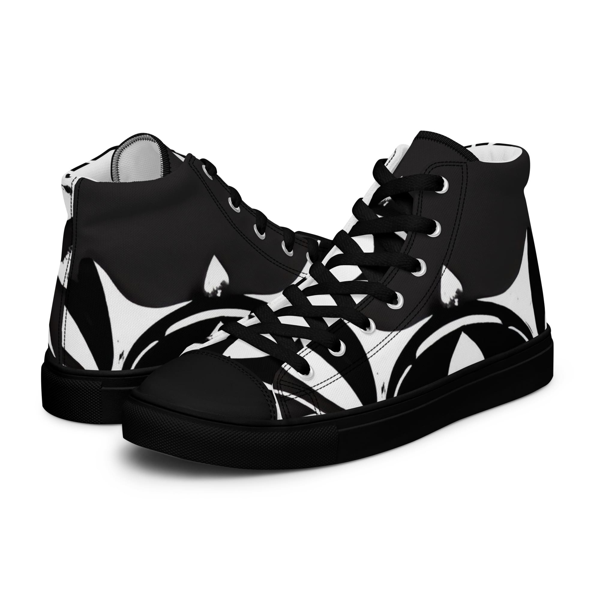 A pair of black and white shoes with a design on them.